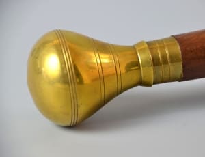 brass and brown wooden curtain rod thumbnail