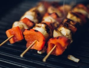 3 grilled meats with sliced vegetable on skewers thumbnail