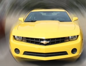 yellow Chevrolet sport car on gray background thumbnail