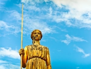 woman holding stick statue thumbnail