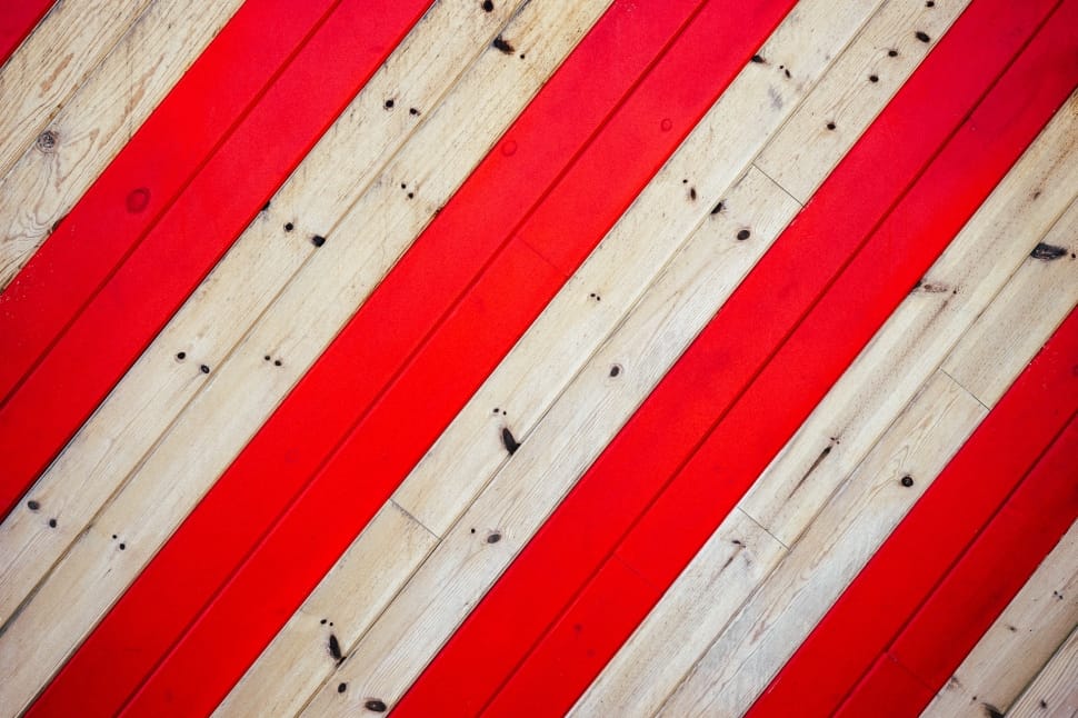 close up photo of red and beige wood floorinbg preview