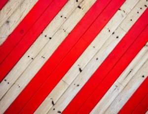 close up photo of red and beige wood floorinbg thumbnail