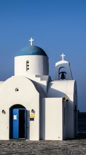 white and blue concrete painted church thumbnail