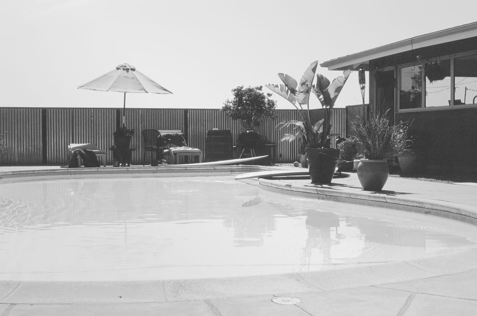 grayscale photo of indoor pool preview