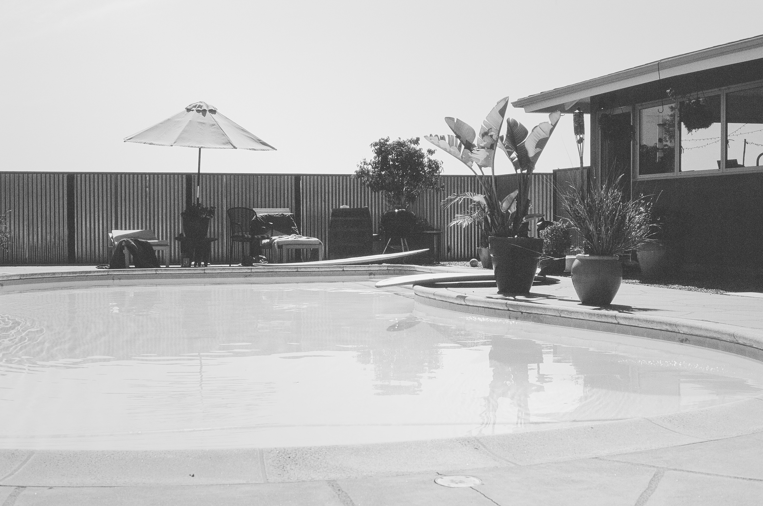 grayscale photo of indoor pool
