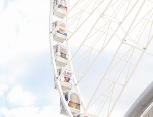 white ferris wheel with nimbus cloud background thumbnail
