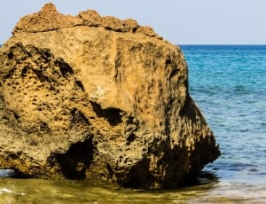 brown stone fragment on sea thumbnail