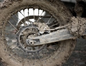 black  motorcycle wheel with mud thumbnail