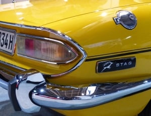 closeup photo of yellow Stag muscle car thumbnail