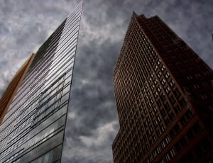 brown high rise building with grey cloudy sky thumbnail