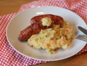 mashed potato and sausages served on white ceramic plate thumbnail