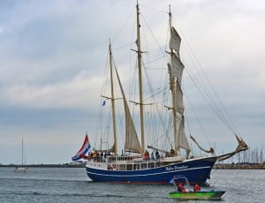blue and white sail boat thumbnail