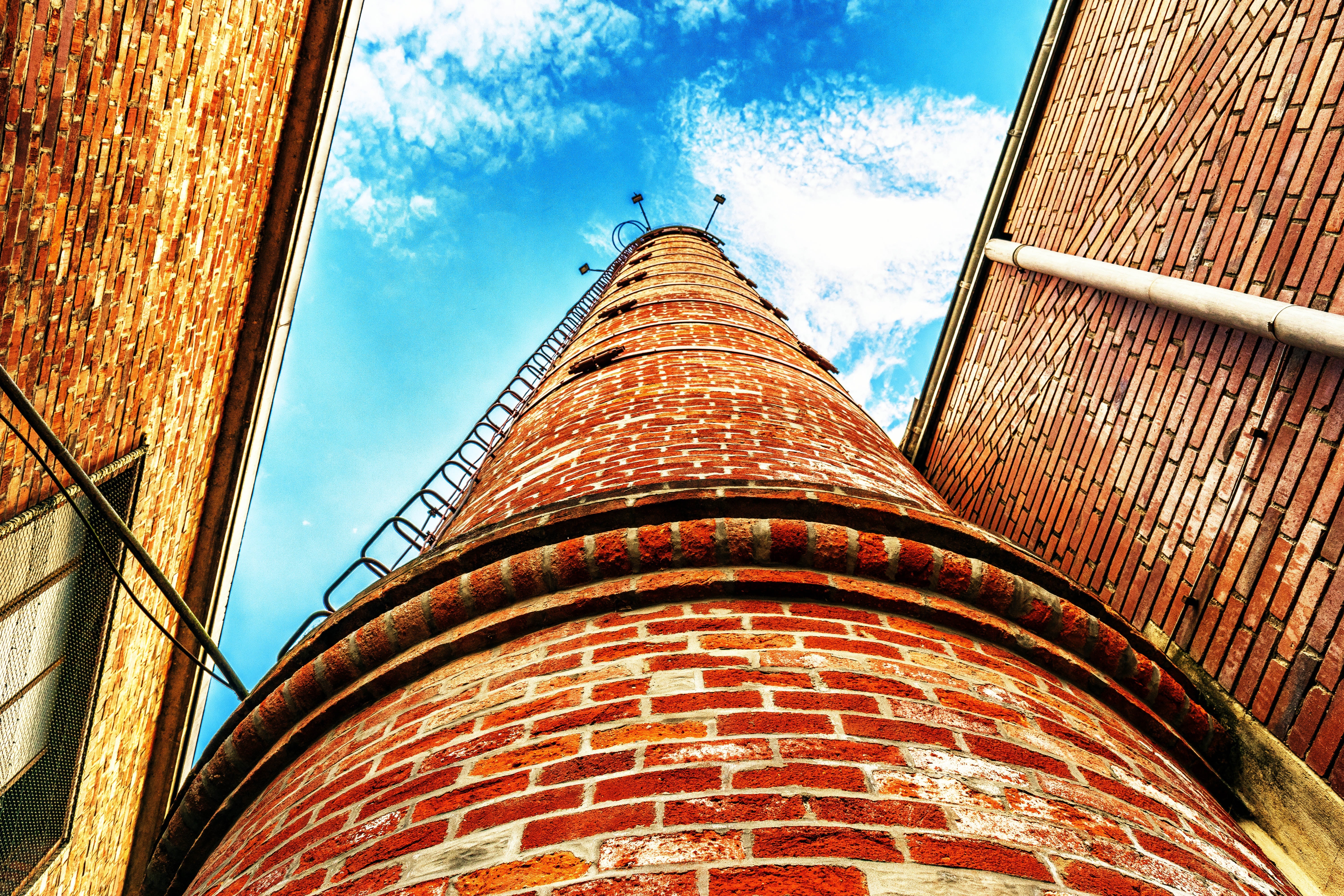 low angle photo of brown brick tower