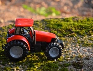 orange and black tractor toy thumbnail