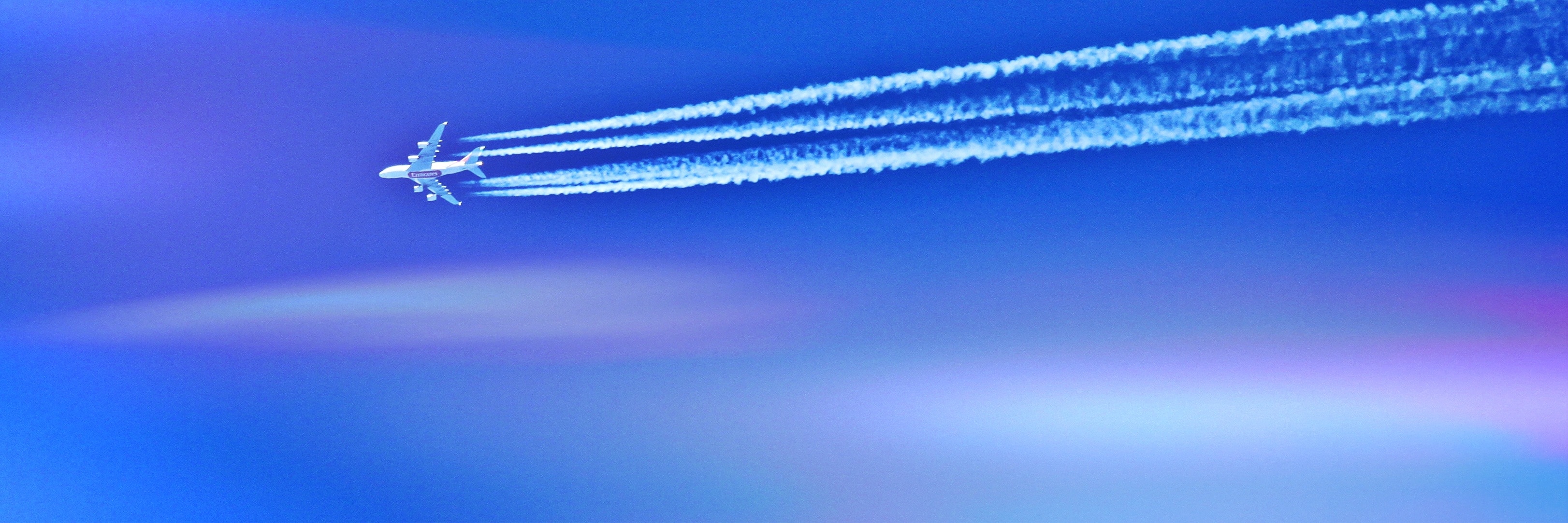 white plane and blue sky