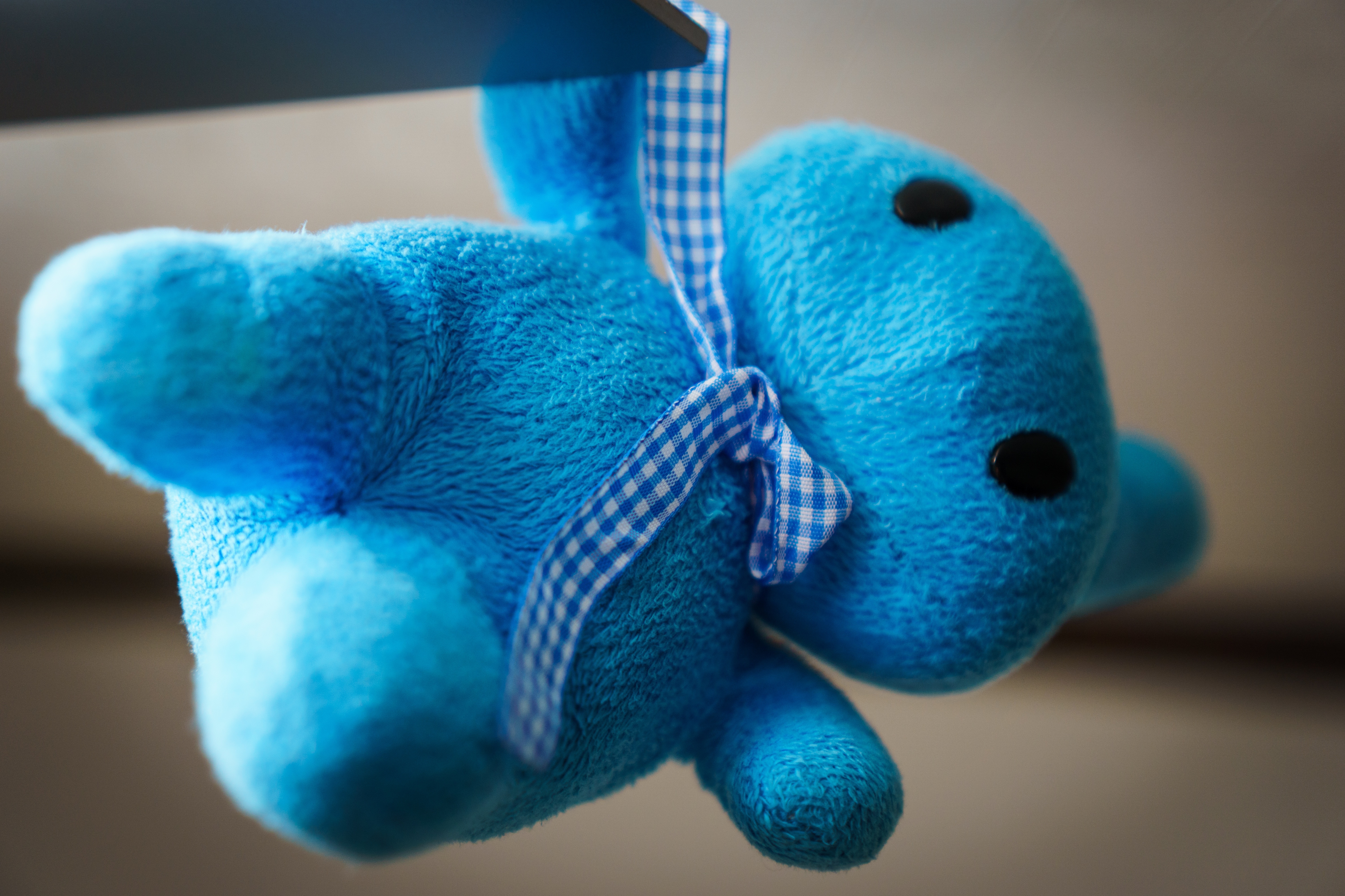 blue plush toy wearing necktie