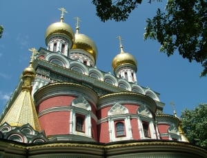 photo of red and brass religious building thumbnail