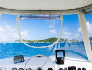 boat sailing sea under clear blue sky during daytime thumbnail