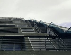 low angle photo of gray concrete building thumbnail