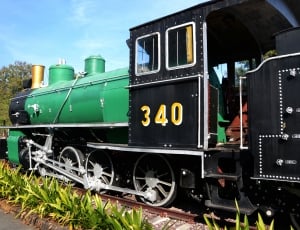 green and black train thumbnail
