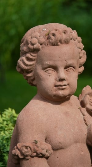 brown child patio figurine thumbnail