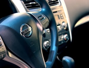 black nissan car steering wheel thumbnail