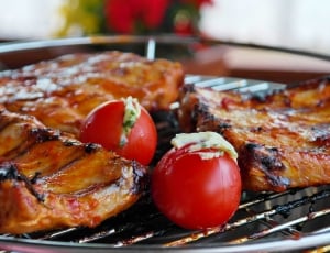 selective focus photo of grill meats and red tomatoes thumbnail