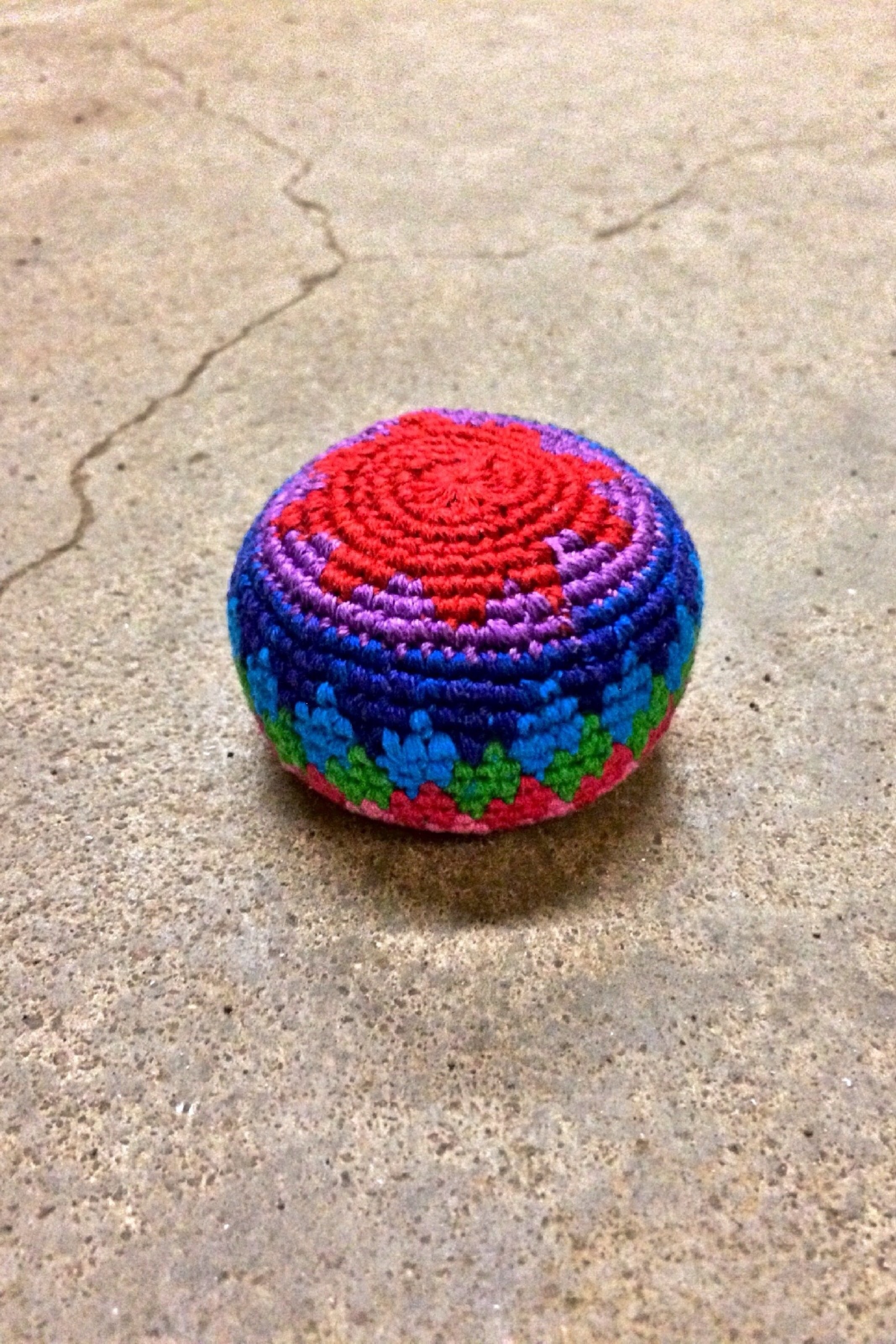 red purple and blue knitted ornament