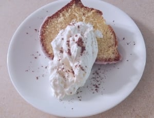 slice bread with cream on white ceramic round plate thumbnail