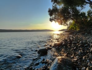 photo of seashore during sunset thumbnail