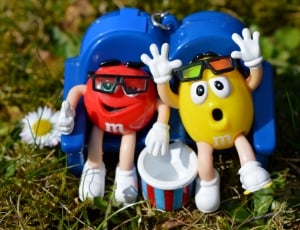 two yellow and red M and M's figurines thumbnail