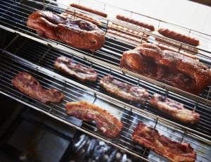 grilled pork on grey metal griller thumbnail