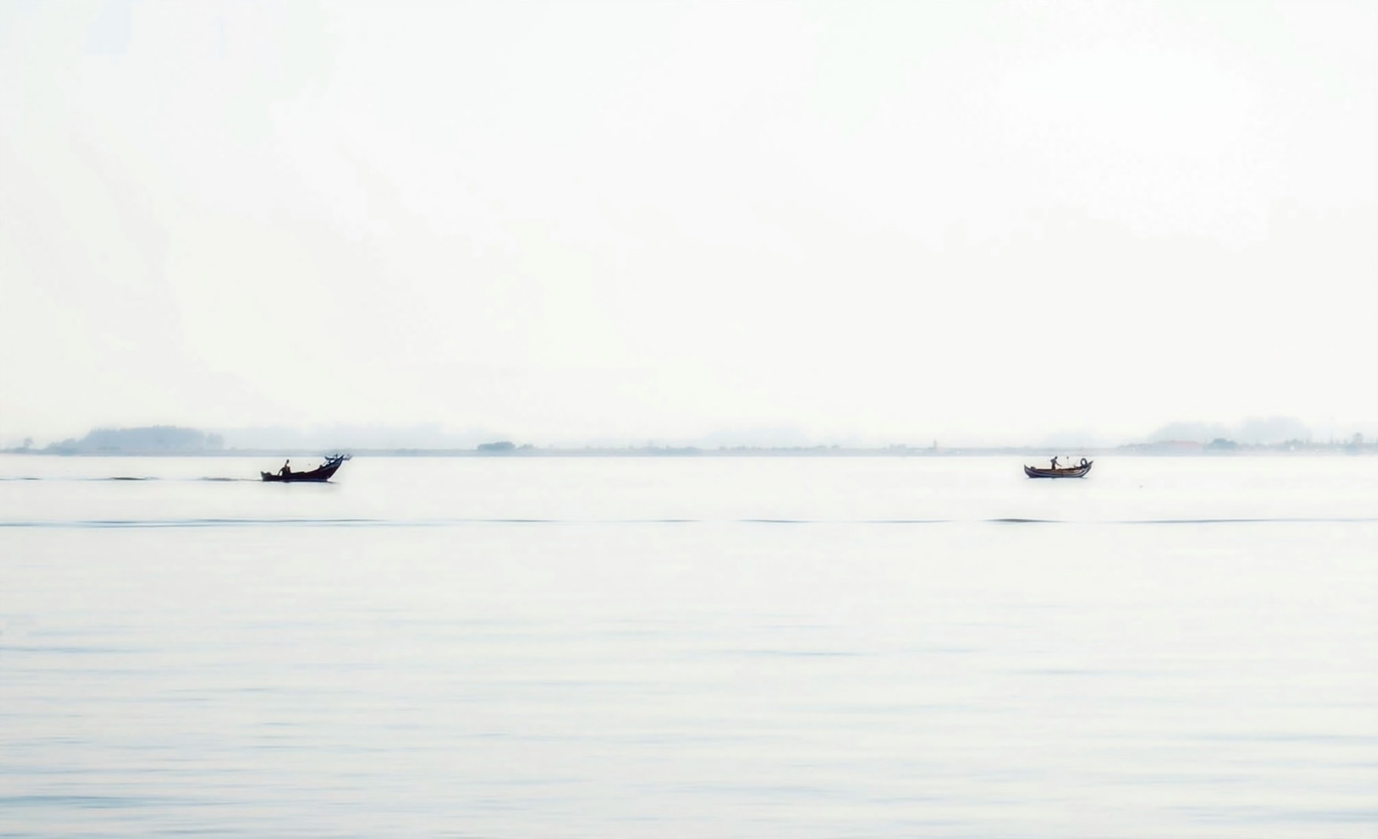 2 black rowboats