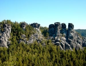 green and rock formation landmark thumbnail