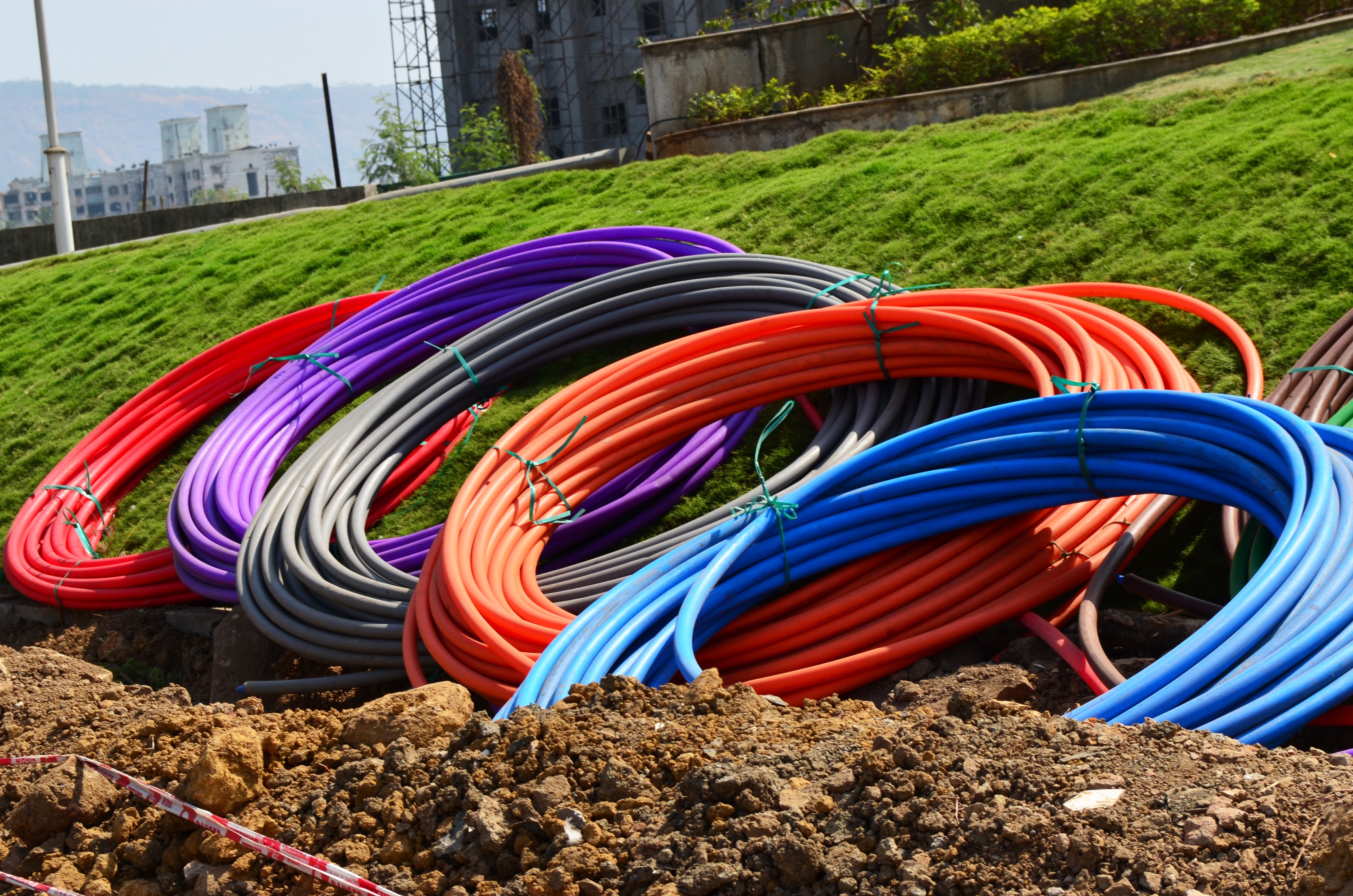 five red, purple, gray, orange, and blue hoses