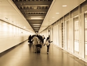 group of people walking in the hallway thumbnail