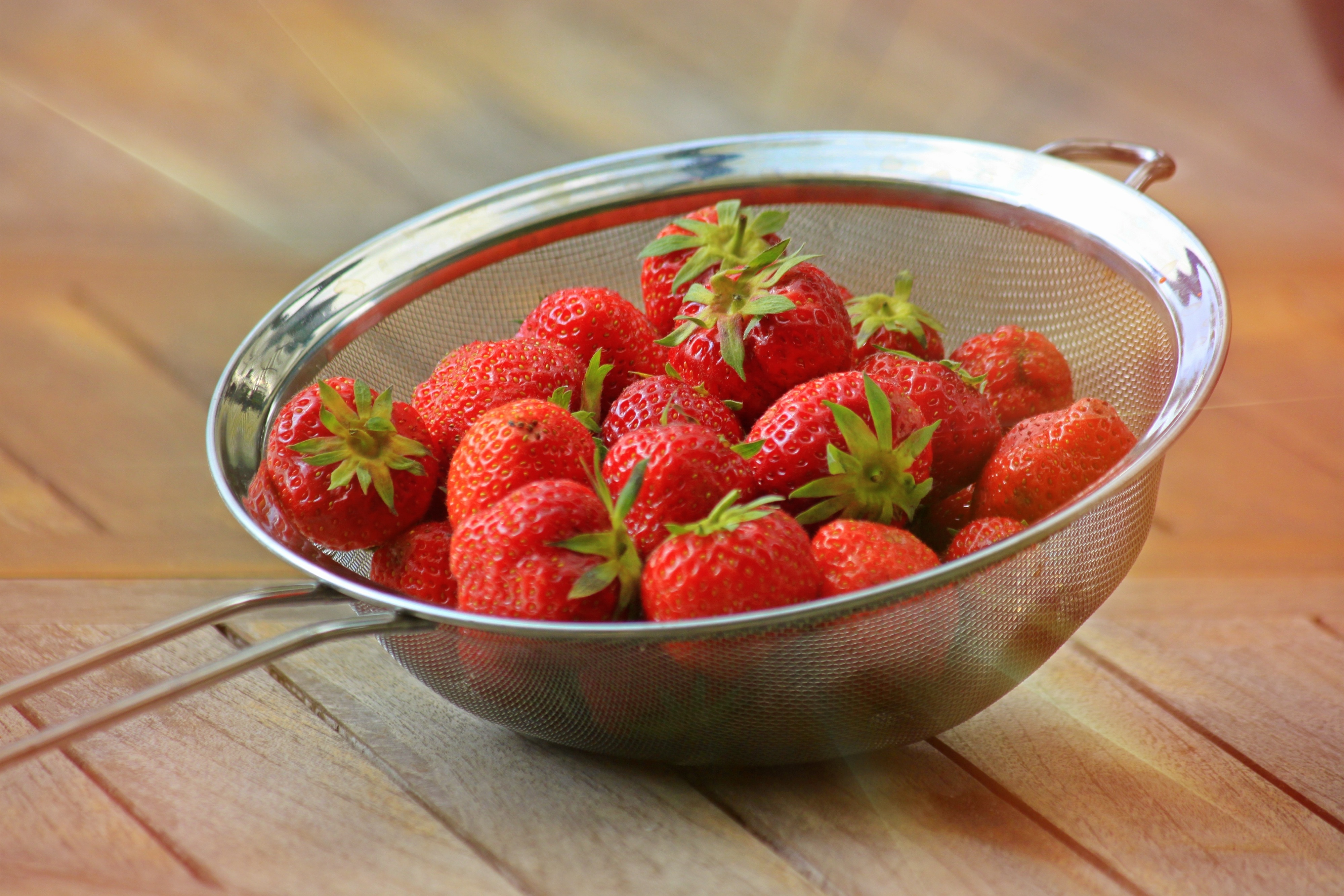 strawberries in strainer