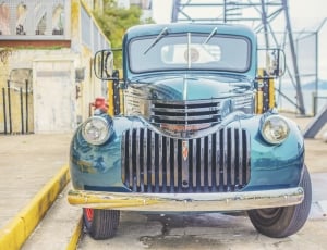 blue and silver vintage pickup truck thumbnail