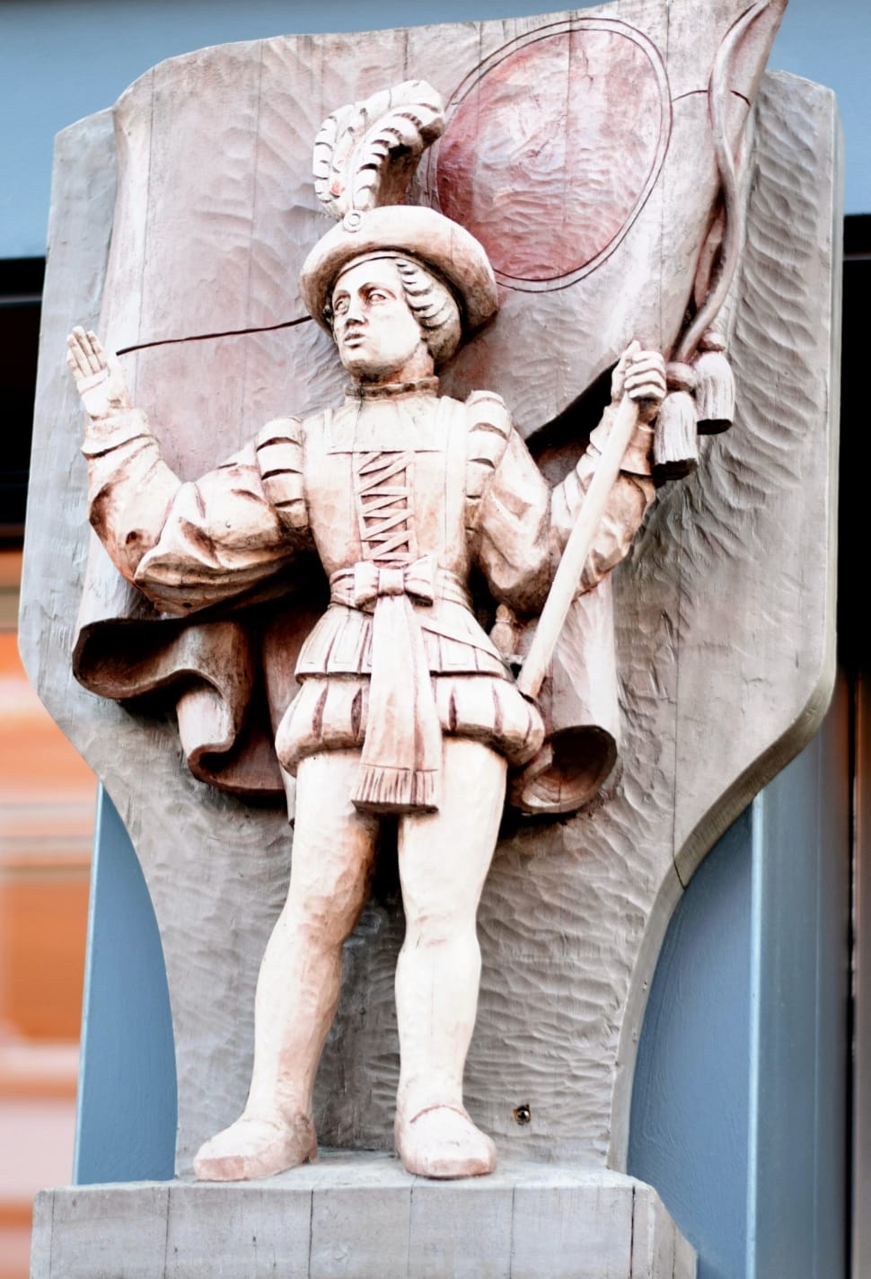 brown statue holding a flag preview
