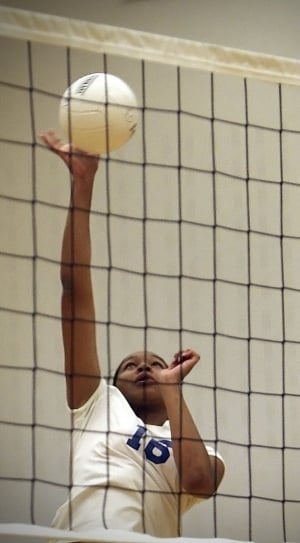 white volley ball with white and black volleyball net thumbnail