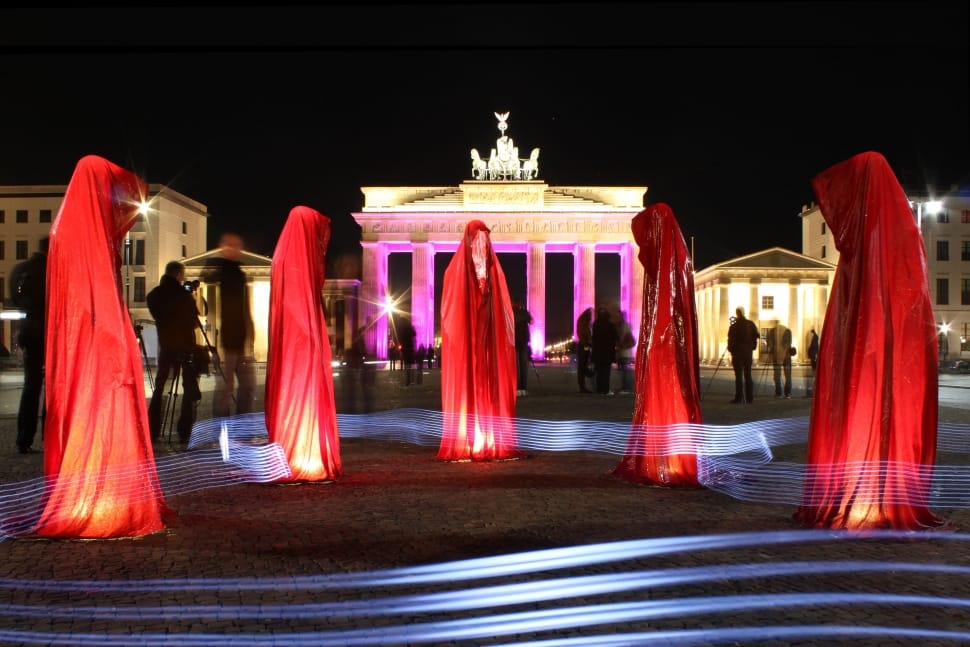 five red dresses lighted statues preview