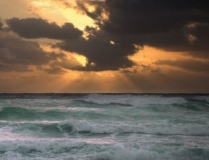 sea waves on sunset thumbnail