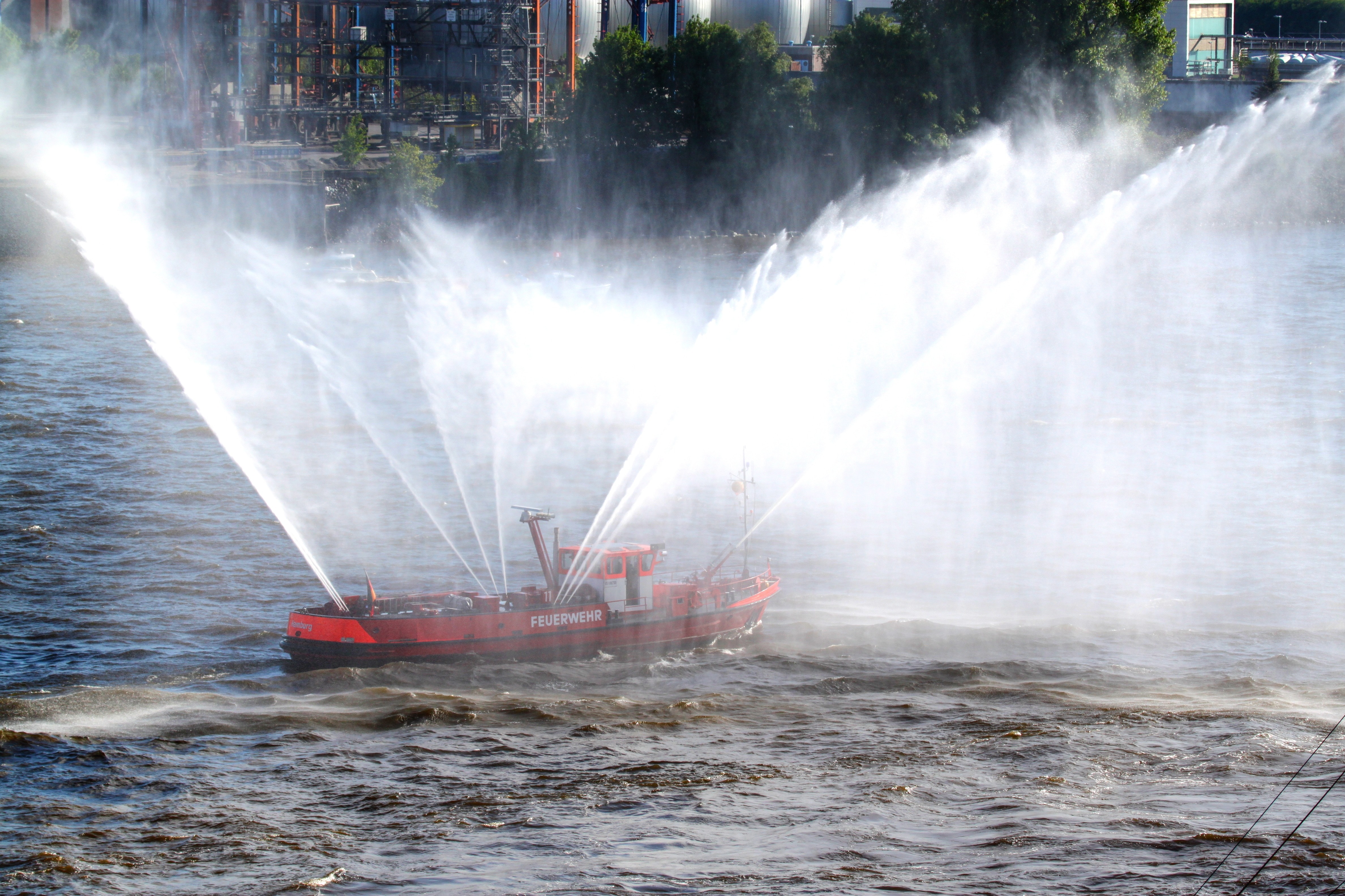 red boat spraying water