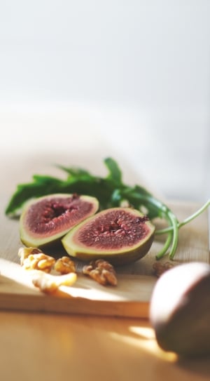 green sliced fruit on brown wooden table thumbnail