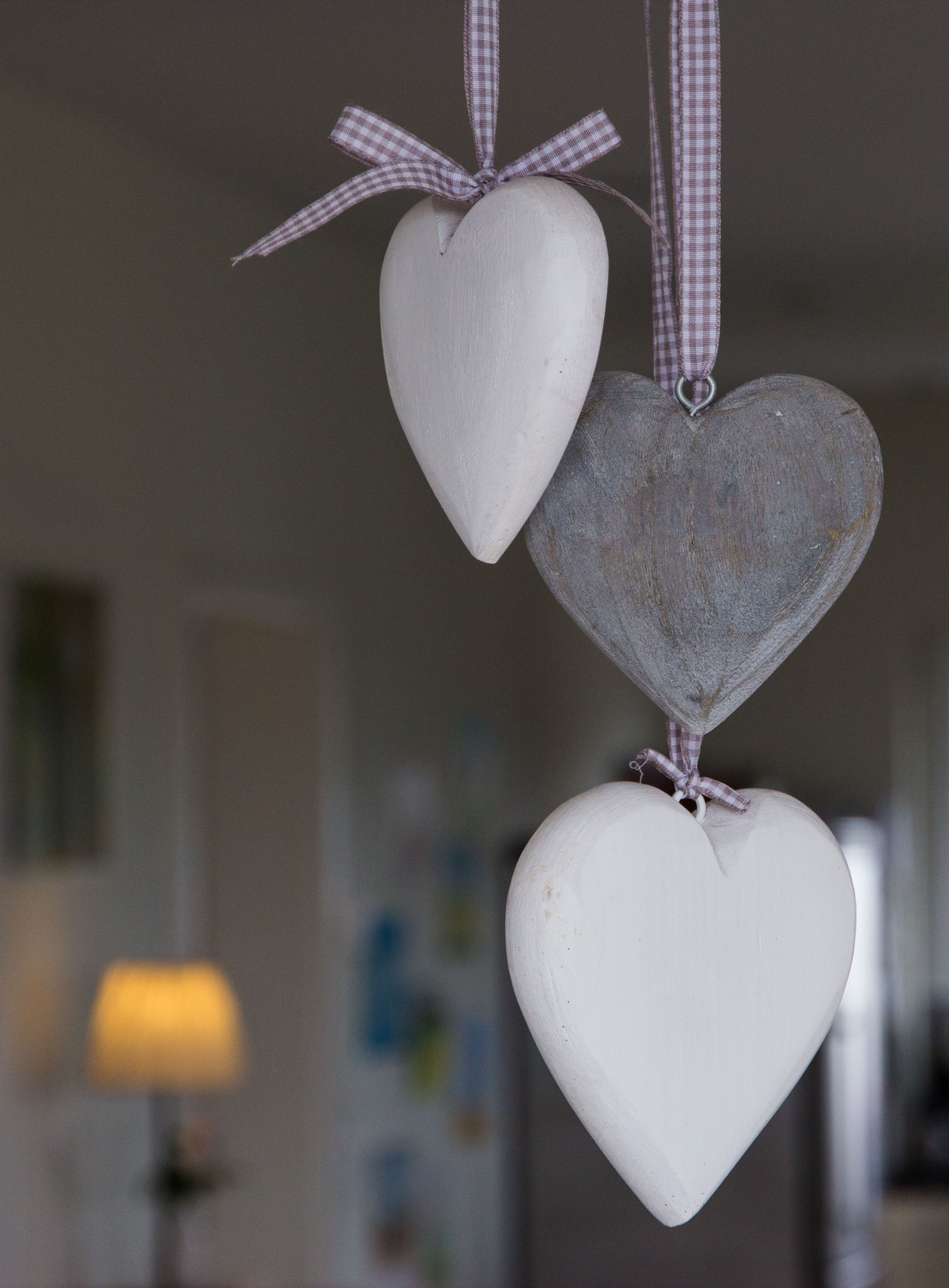 three white and gray heart shapes hanging ornaments