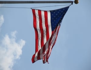 U.S.A. flag under clear blue sky thumbnail