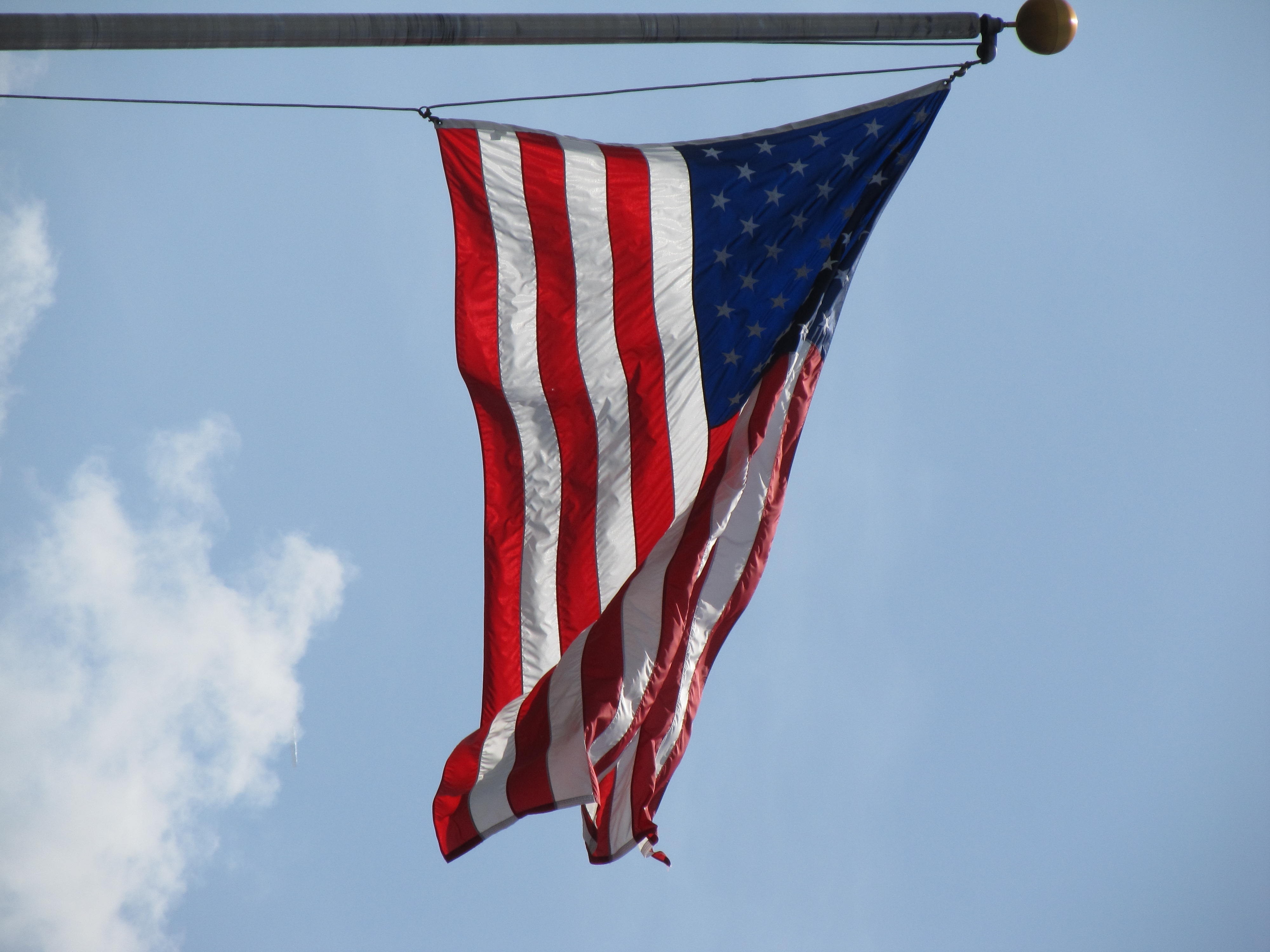U.S.A. flag under clear blue sky