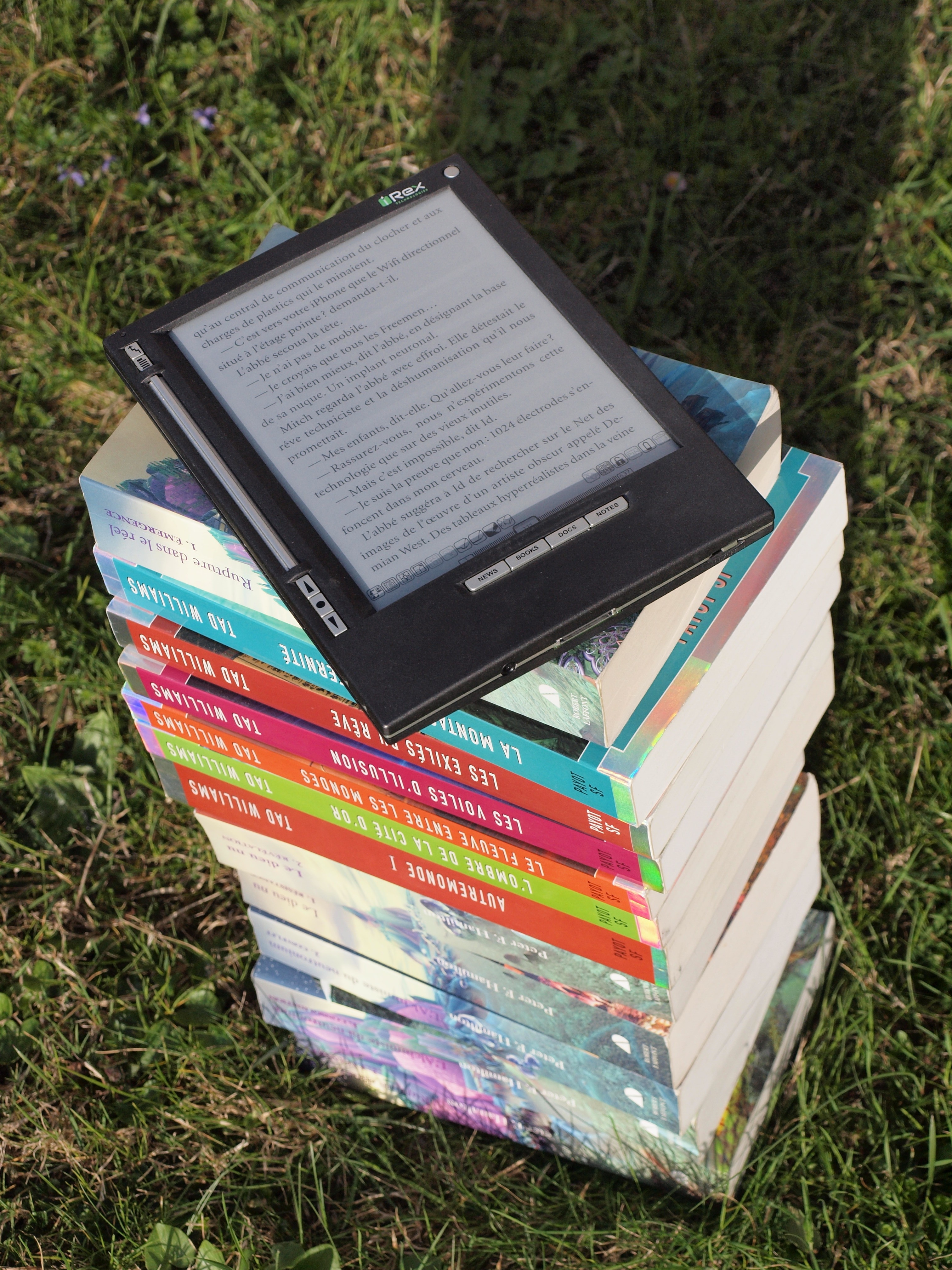 book lot on green grass