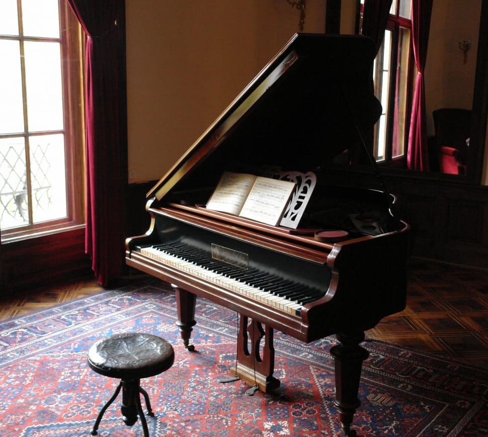 brown wooden grand piano preview