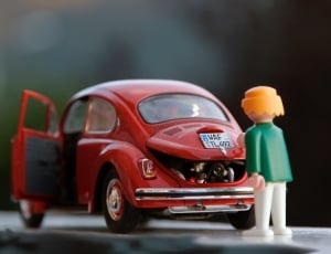 red volkswagen beetle die-cast model thumbnail